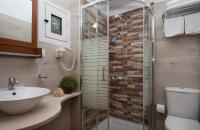 Cretan Villa triple room, bathroom with shower cubicle, hairdryer and bathroom toiletries
